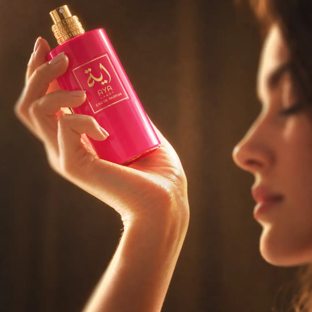 AYA CANDY for women perfume being sprayed onto a wrist