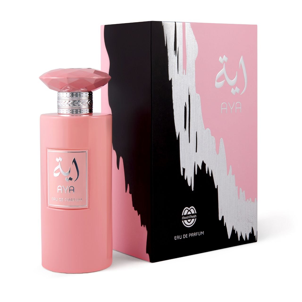 AYA Eau de Parfum opaque light pastel pink bottle with metallic silver accents, standing next to its matching pink and black presentation box adorned with silver paint-drip graphic artwork.