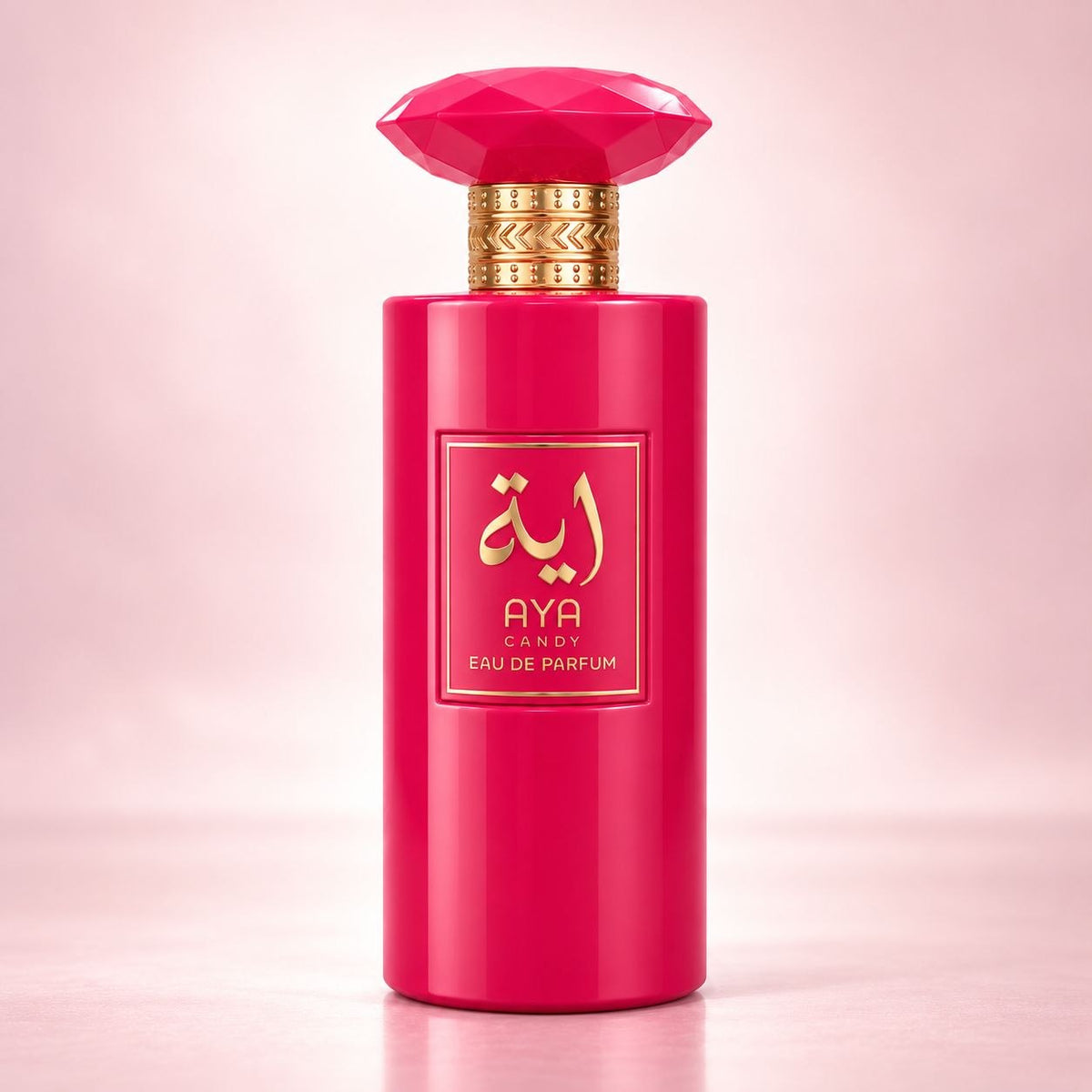 MUSHMUSH Aya Candy Eau de Parfum, vibrant women’s fragrance in a glossy fuchsia bottle with gold detailing and faceted jewel cap.