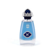 BURKAN Eau de Parfum clear glass bottle filled with light blue liquid, featuring a royal blue oval crest with silver filigree bordering and Arabic calligraphy, topped with an ornate silver and dark blue dome cap.