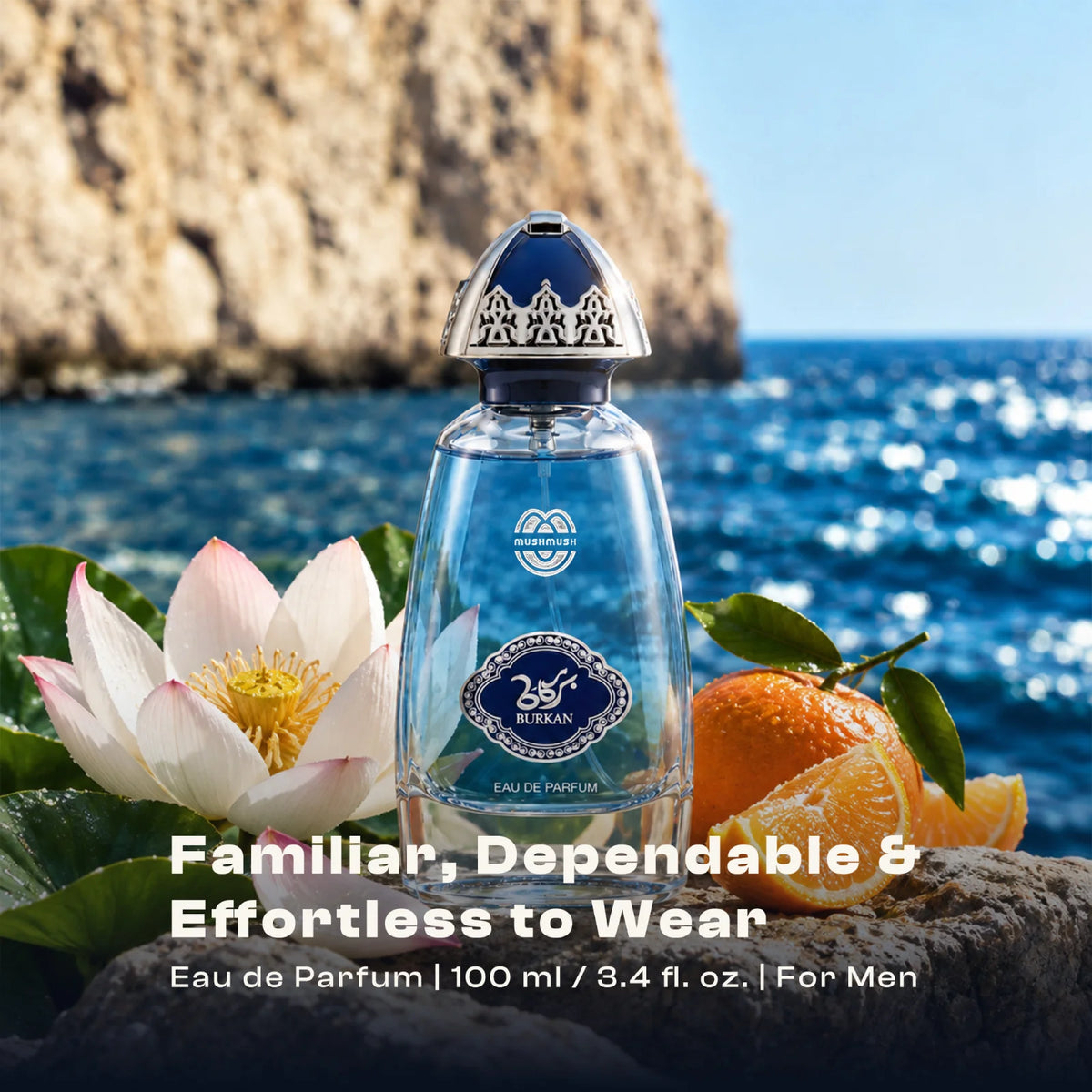 Burkan perfume bottle by the sea with a lotus flower, orange and a coastal cliff