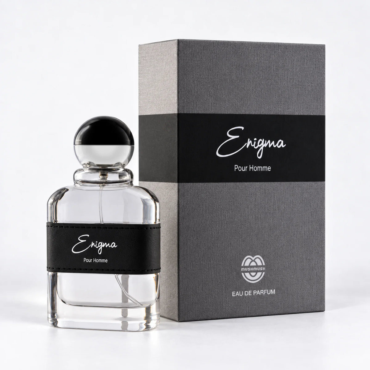 Enigma perfume bottle beside its matching packaging box by MUSHMUSH