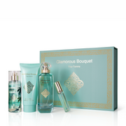 Glamorous Bouquet Pour Femme 4-piece fragrance gift set by MushMush, including a tropical-themed body mist spray, light teal body lotion tube, elegant glass perfume bottle, and travel atomizer standing beside a mint green gift box decorated with gold damask filigree.