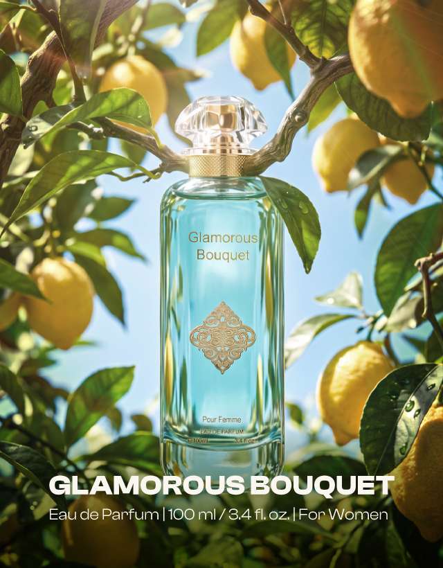MUSHMUSH Glamorous Bouquet women perfume, 100ml Eau de Parfum, affordable luxury fragrance in an aqua blue bottle surrounded by fresh lemons and green leaves.