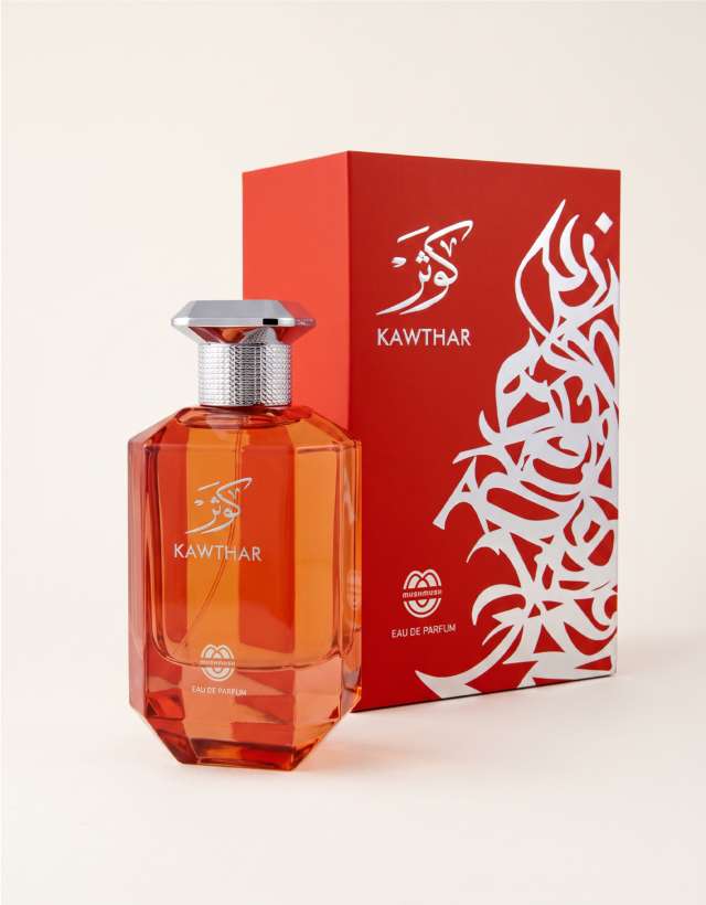 KAWTHAR Eau de Parfum by MUSHMUSH, an affordable luxury fragrance , featuring an orange glass bottle alongside its matching red packaging box.