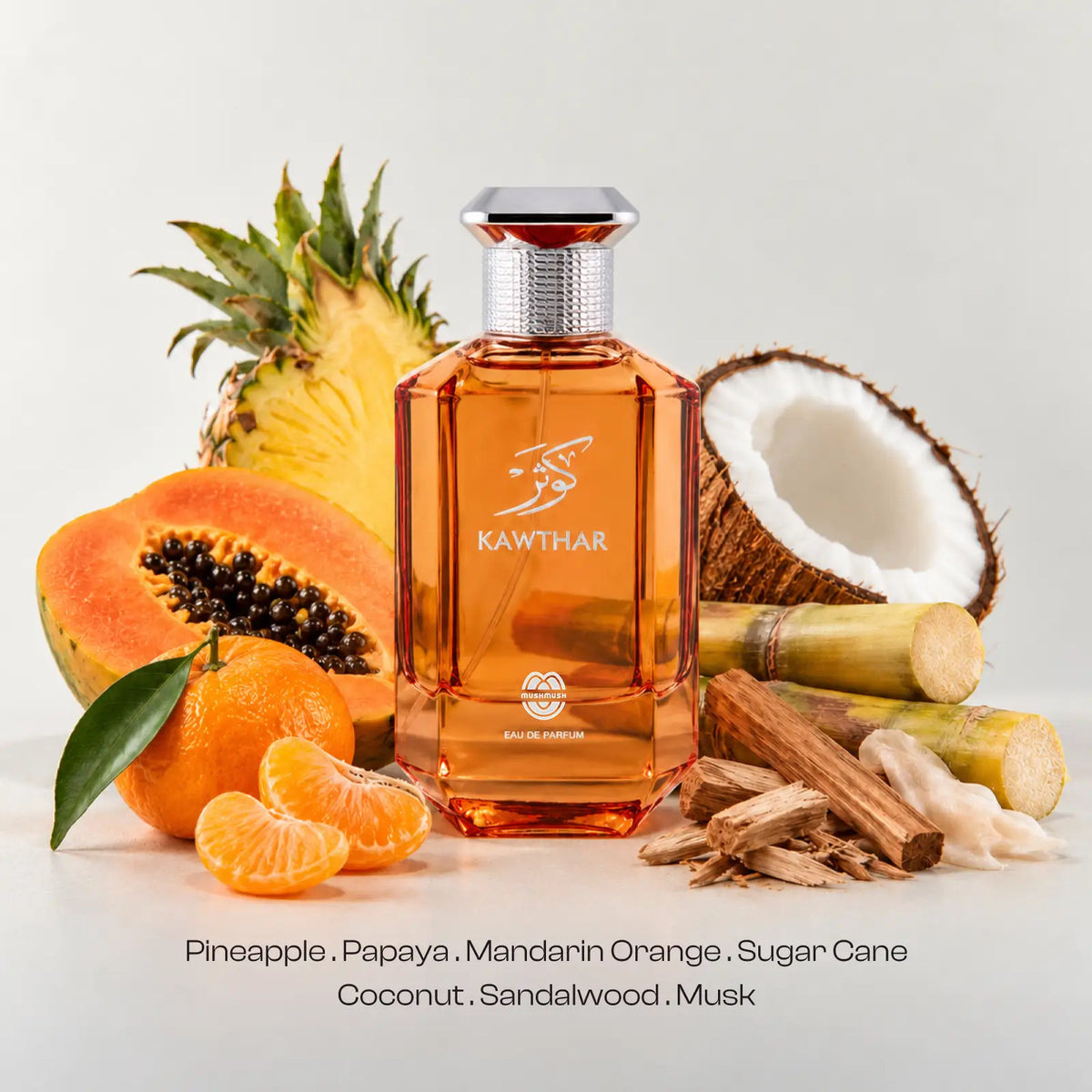 Kawthar perfume bottle for women surrounded by pineapple, papaya, coconut and citrus.