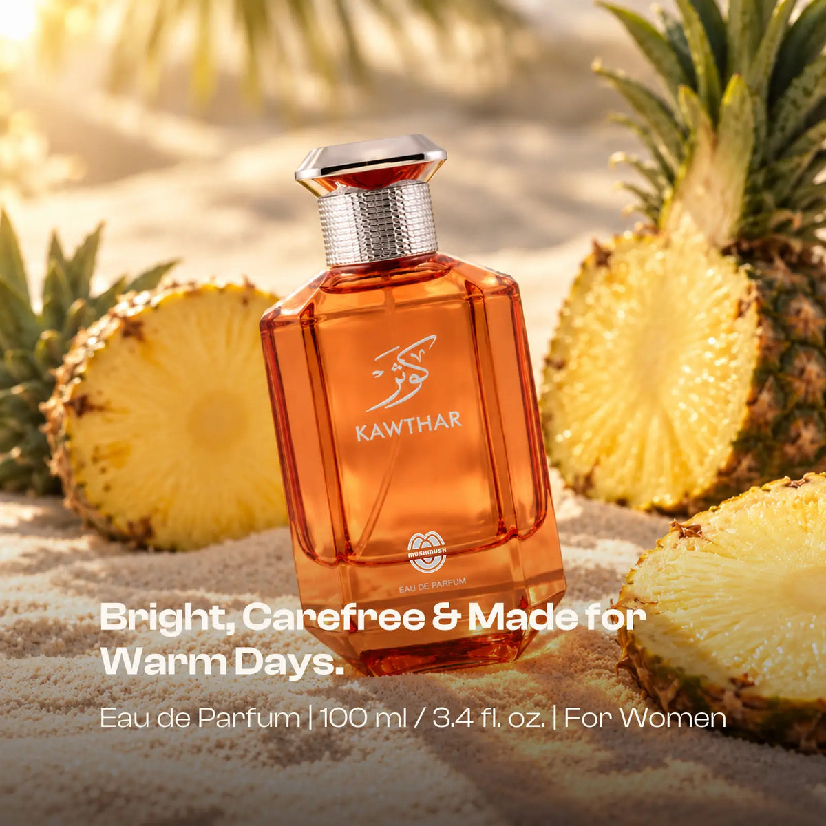 Kawthar perfume bottle on sand among cut pineapples in warm sunlight