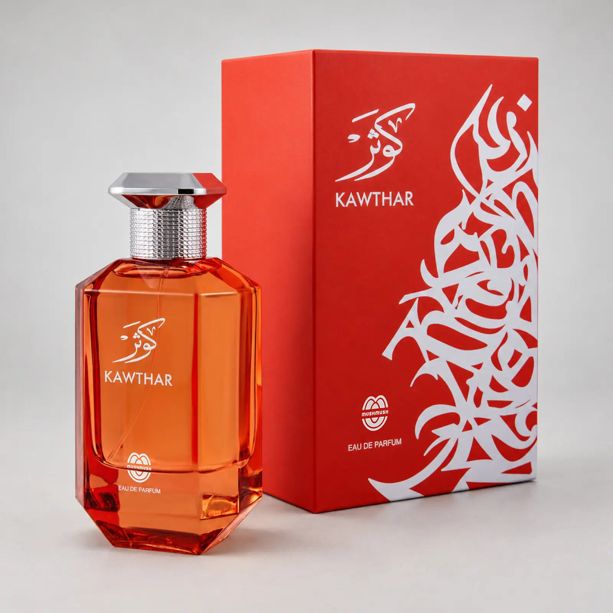 Kawthar perfume bottle beside its red packaging box with white calligraphy by MUSHMUSH