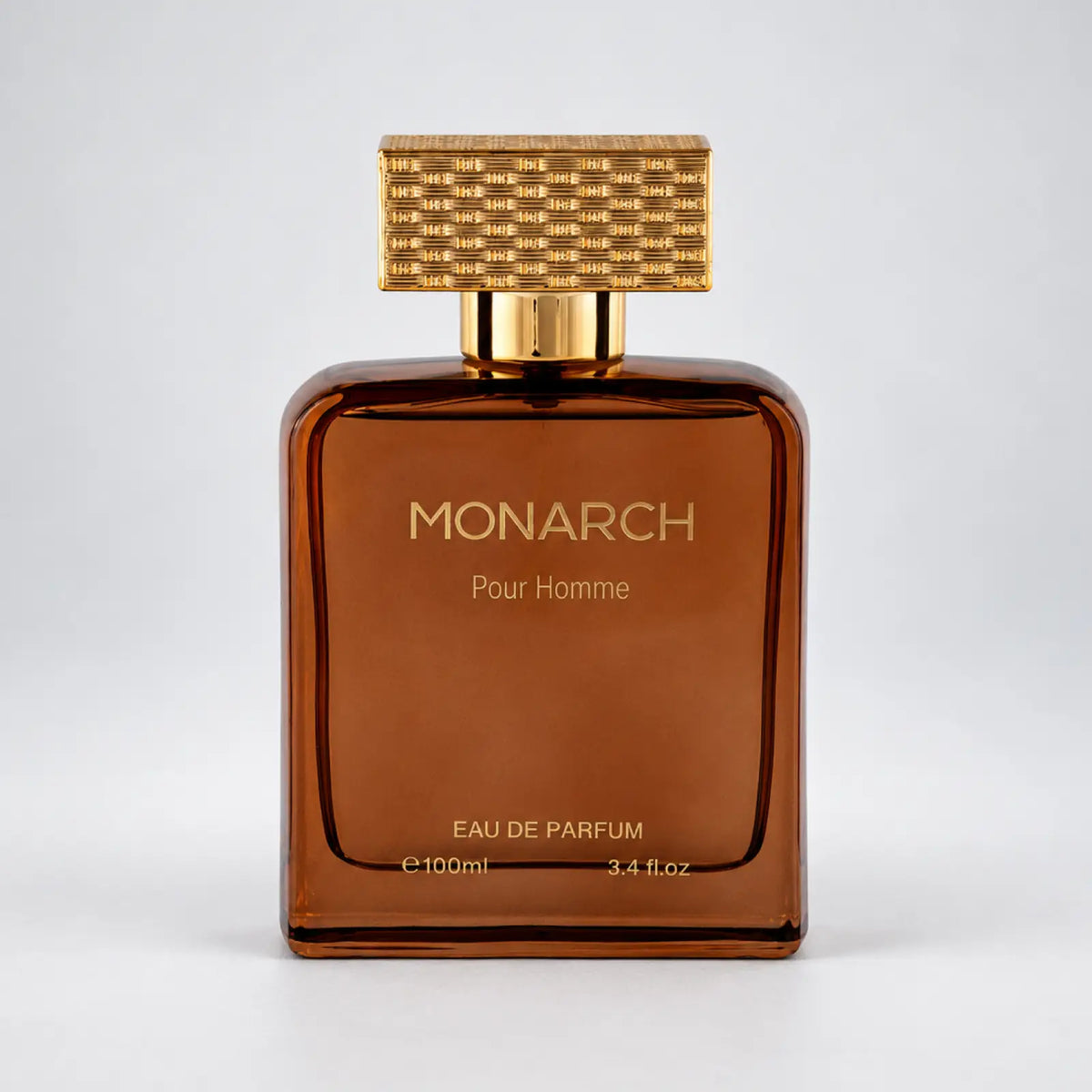 Monarch perfume bottle by MUSHMUSH with a gold cap and brown glass bottle.
