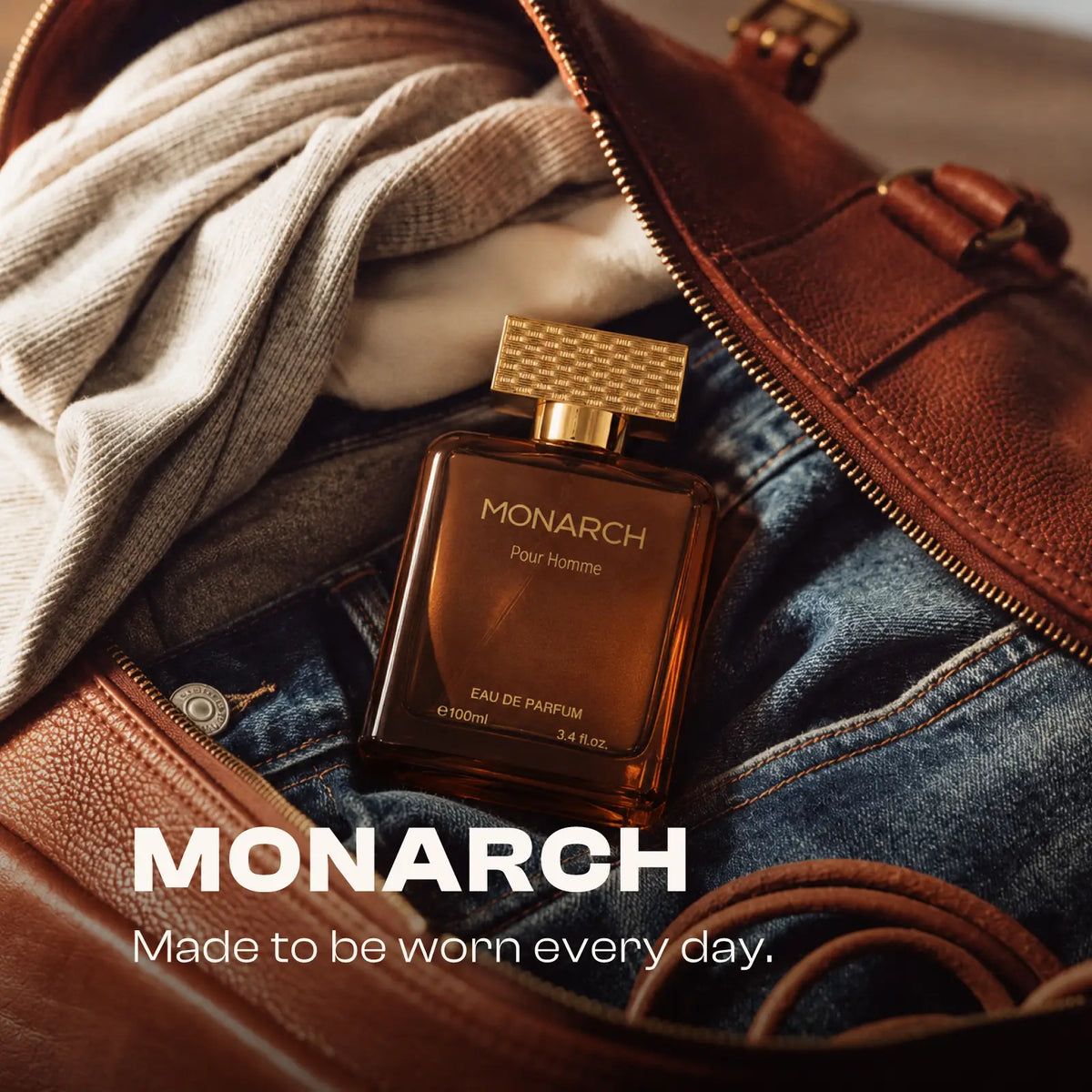 Monarch perfume for men and women styled with casual clothing and a leather bag.
