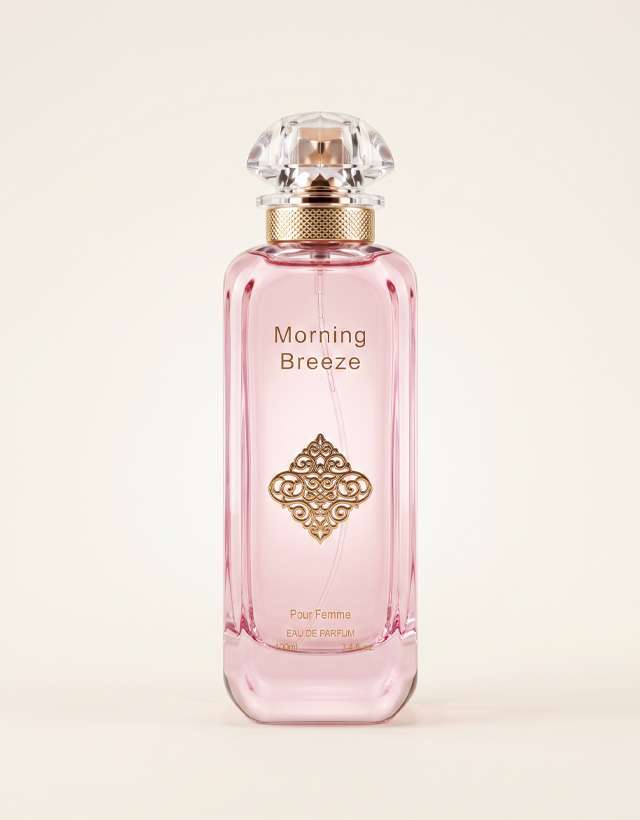 MUSHMUSH Morning Breeze ladies fragrance, 100ml EDP, elegant feminine scent in a blush pink perfume bottle with ornate gold emblem, clear jewel cap and refined luxury design.