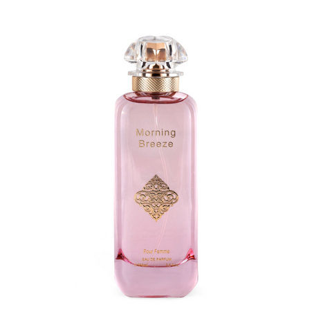 Morning Breeze Pour Femme Eau de Parfum tall rectangular soft pink glass bottle topped with a clear crystal crown cap, featuring a gold filigree emblem on the front.