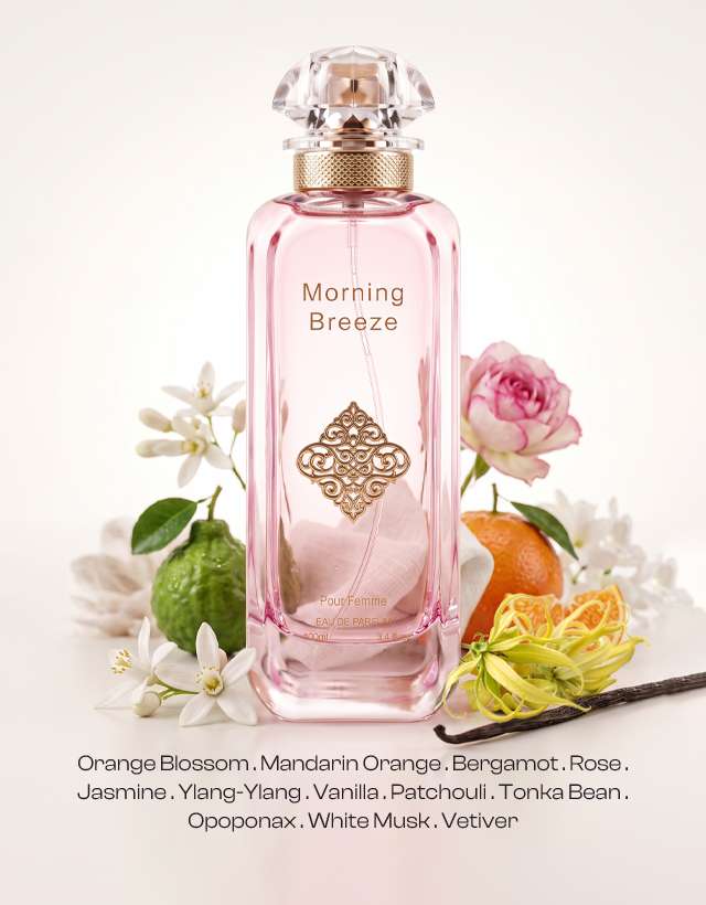 Morning Breeze women’s EDP, elegant feminine floral citrus fragrance with orange blossom, mandarin orange, bergamot, rose, jasmine, ylang-ylang, vanilla, patchouli, tonka bean, opoponax, white musk and vetiver, presented in a blush pink bottle with gold details and crystal-style cap.