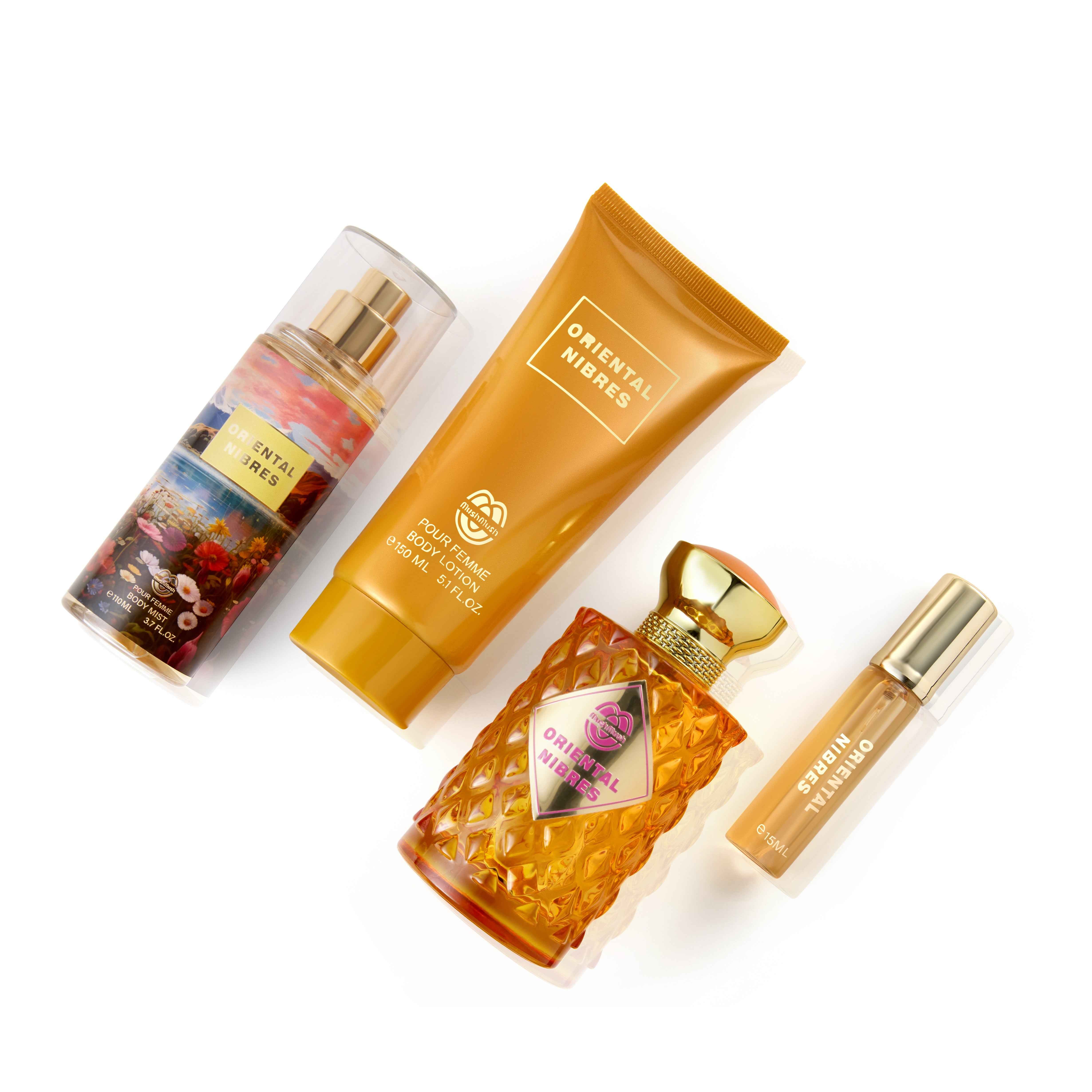 ORIENTAL NIBRES Pour Femme 4-piece fragrance gift set by MushMush, including a body mist spray, golden body lotion tube, textured yellow perfume bottle with a gold cap, and travel spray, displayed in front of a colorful floral gift box.