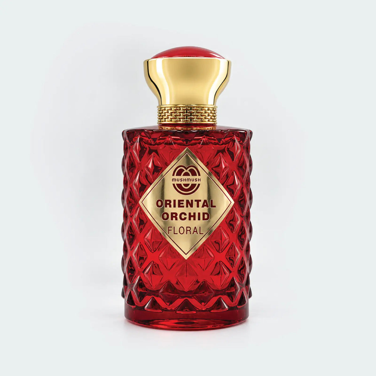 Oriental Orchid Floral Pour Femme red cut-glass bottle with a gold cap by MUSHMUSH