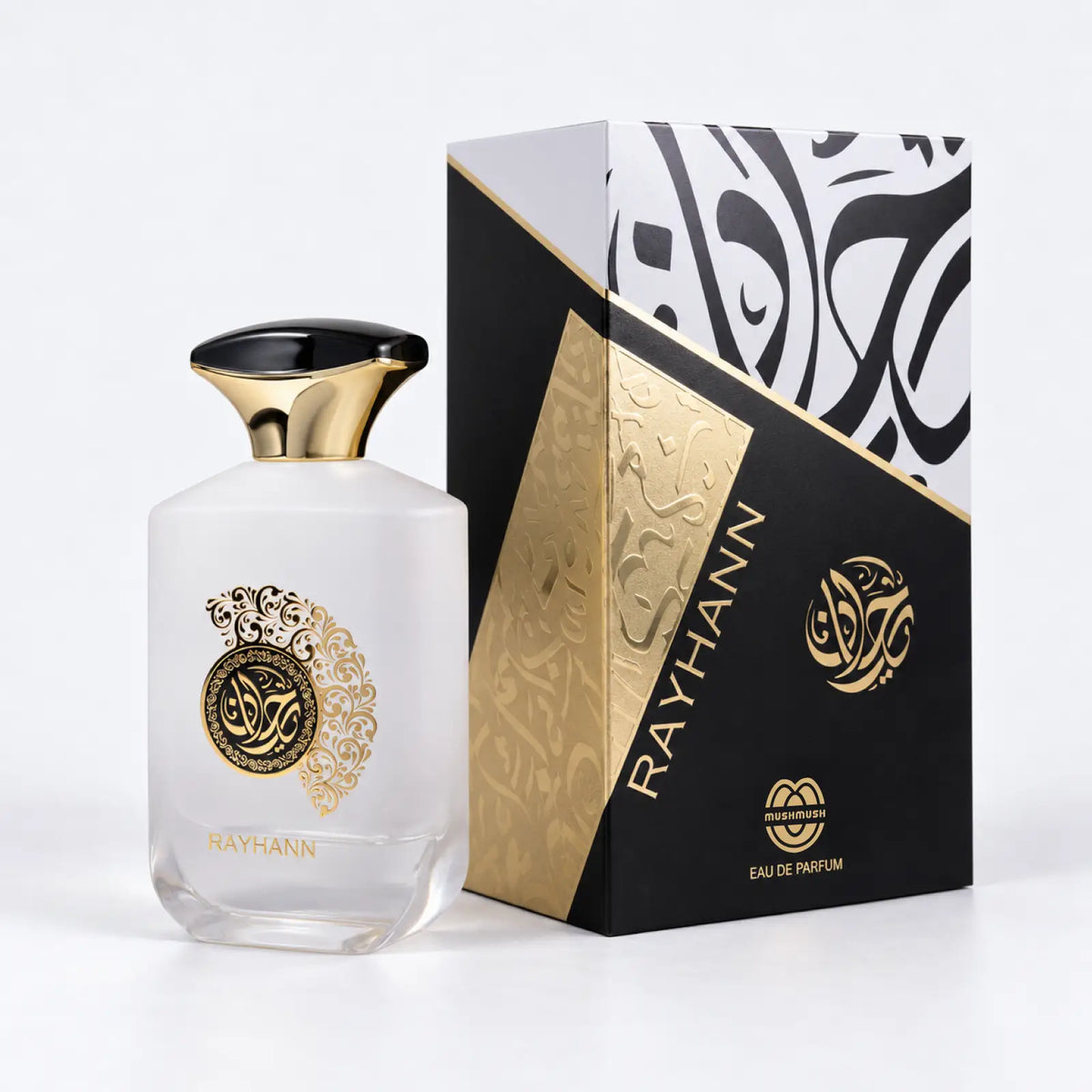 Rayhann perfume bottle beside its black and gold calligraphy packaging box by MUSHMUSH