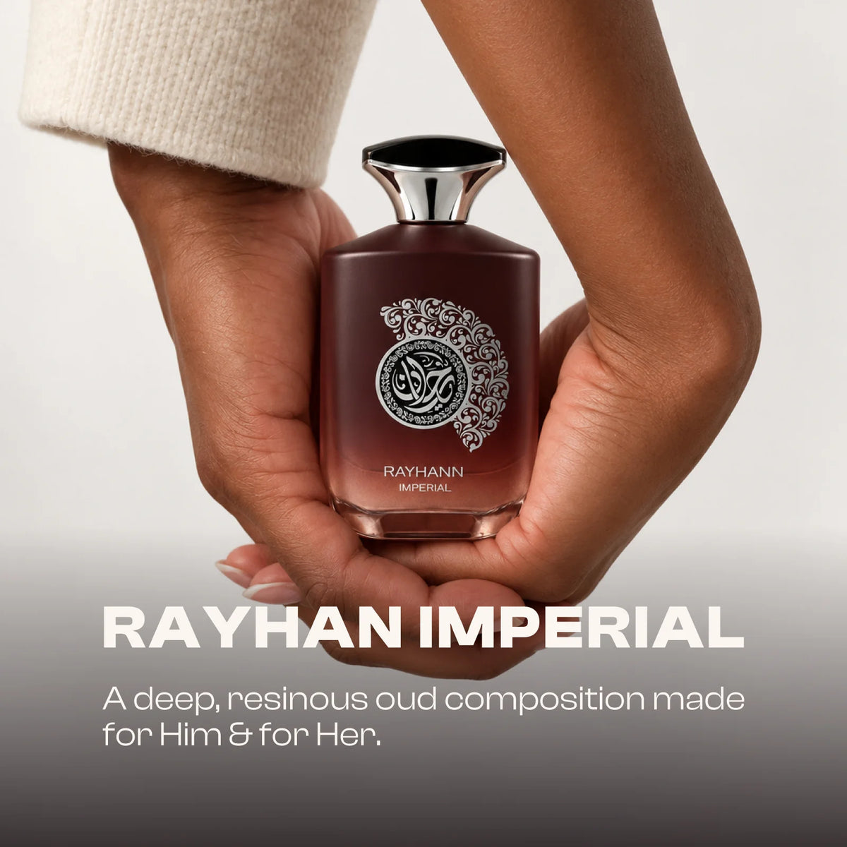 Rayhann Imperial for men and women perfume bottle held between two hands