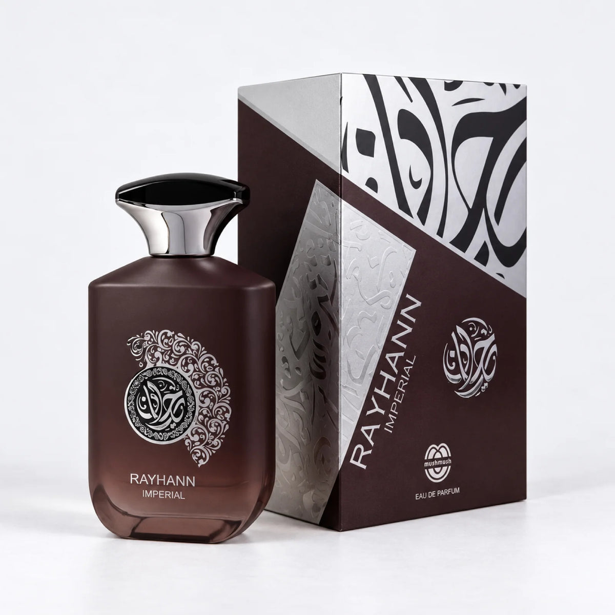 Rayhann Imperial perfume bottle beside its dark brown and silver packaging box by MUSHMUSH