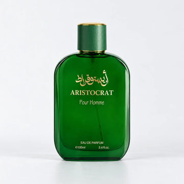 Aristocrat Pour Homme emerald green perfume bottle with a green cap and gold Arabic script by MUSHMUSH