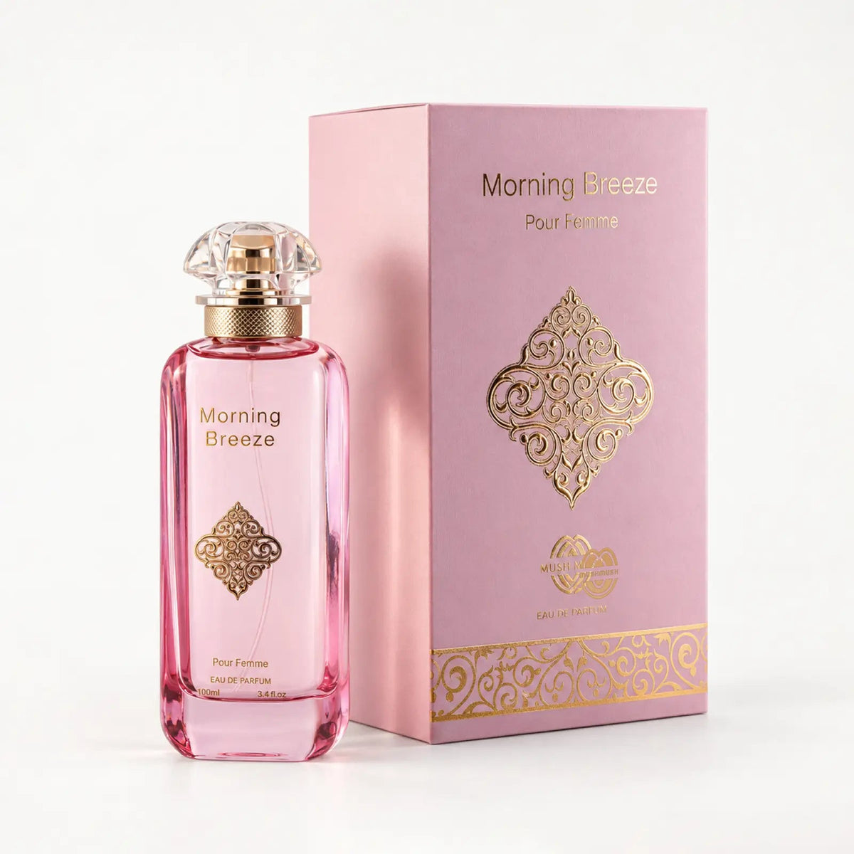 Morning Breeze perfume bottle beside its pink packaging box with a gold medallion by MUSHMUSH
