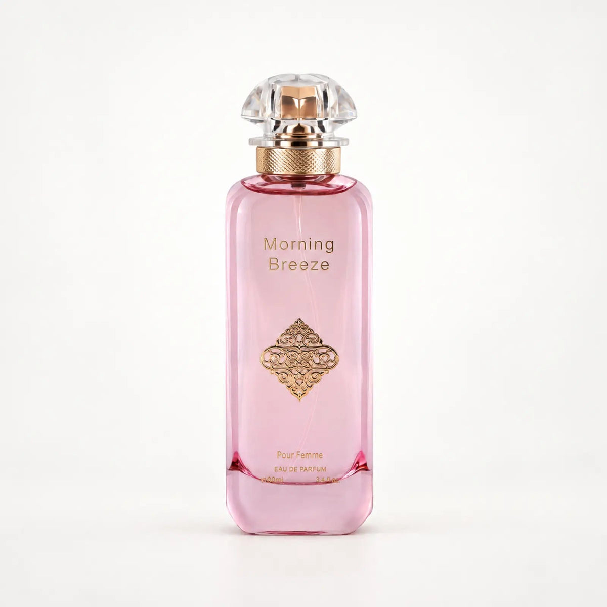 Morning Breeze Pour Femme pink perfume bottle with a crystal cap and gold medallion by MUSHMUSH
