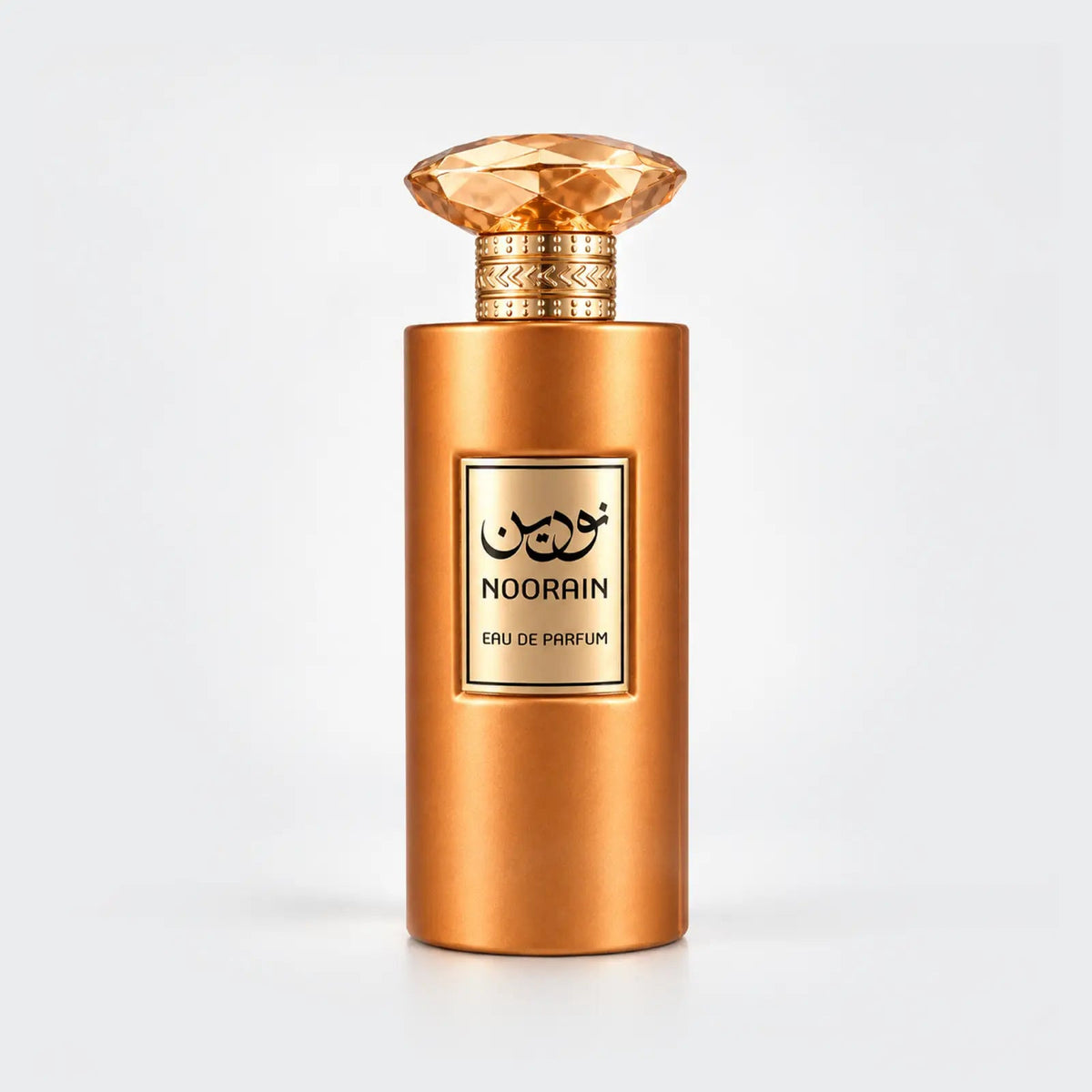 Noorain for women gold perfume bottle with a faceted amber cap and gold label by MUSHMUSH