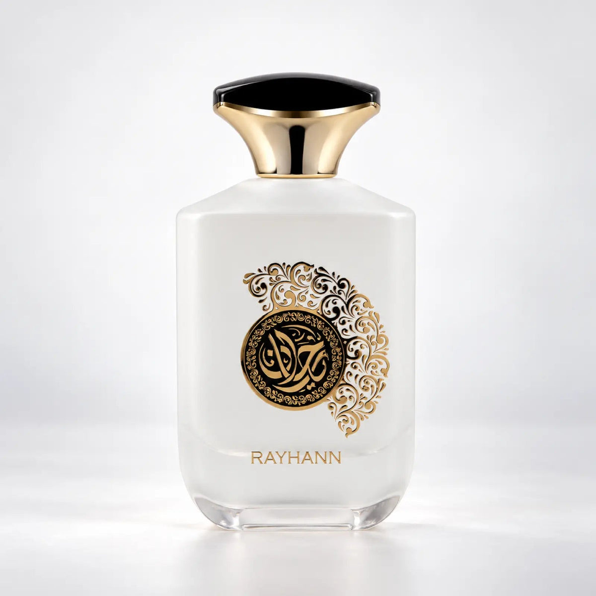 Rayhann white perfume bottle with a black and gold cap and gold medallion by MUSHMUSH